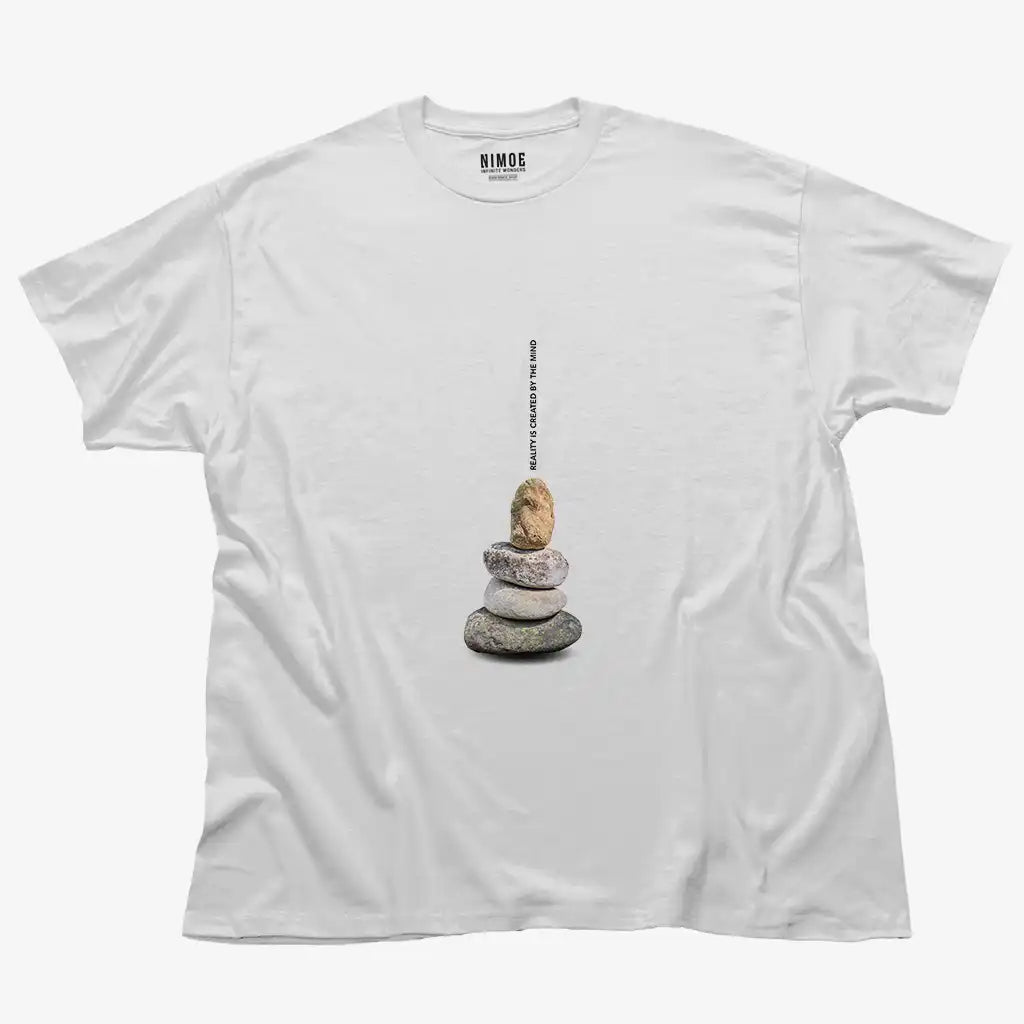 Reality is created by the mind unisex classic t-shirt in white color displaying stones stacked in balance.